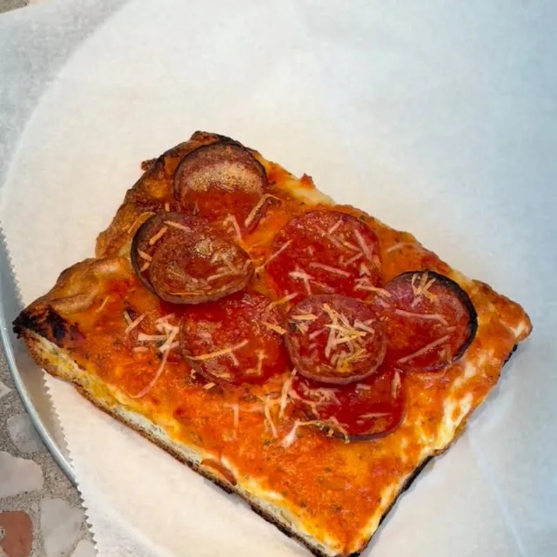 Sicilian slice with vodka sauce, pepperoni and hot honey.